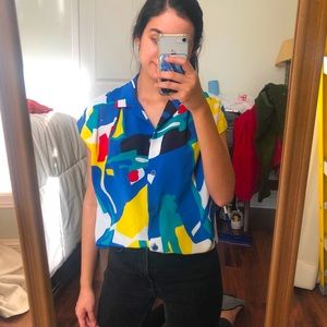 Bright colored button-down blouse
